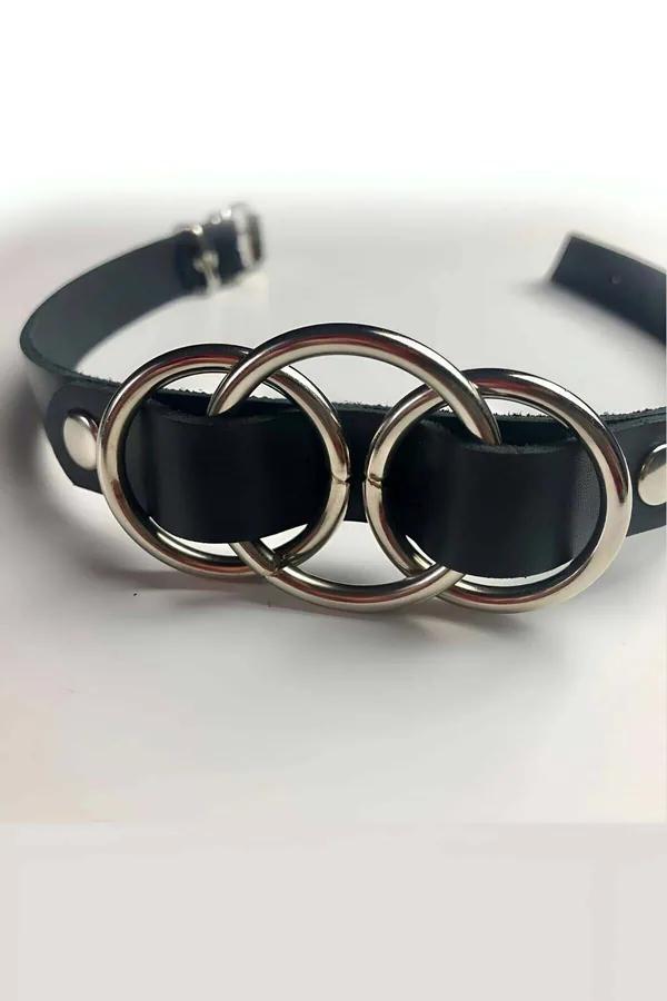 Triple ring black faux leather choker with three interlocking silver O-rings and rivet studs on flat wide band