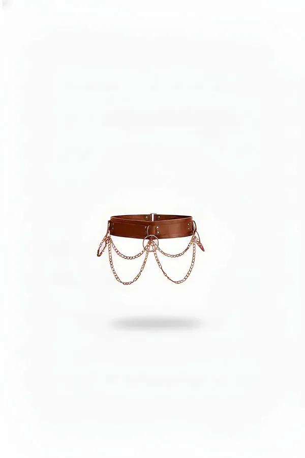Brown vegan leather waist harness with rose gold cascading chain swags and center O-ring, wide structured band