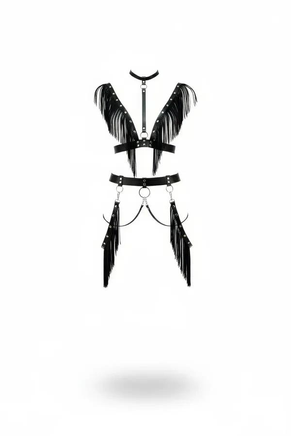 Black faux leather fringed full body harness with choker collar, silver O-rings, and cascading hip fringe panels on white bac