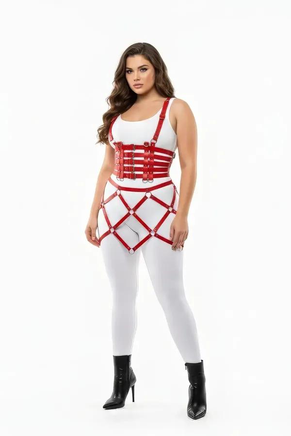 Red faux leather caged harness skirt and bustier set with gold-tone O-rings and diagonal strap grid worn over white outfit
