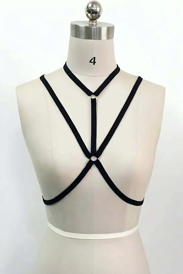 Black elastic strappy O-ring neck chest harness with dual silver O-rings and geometric cross straps on dress form