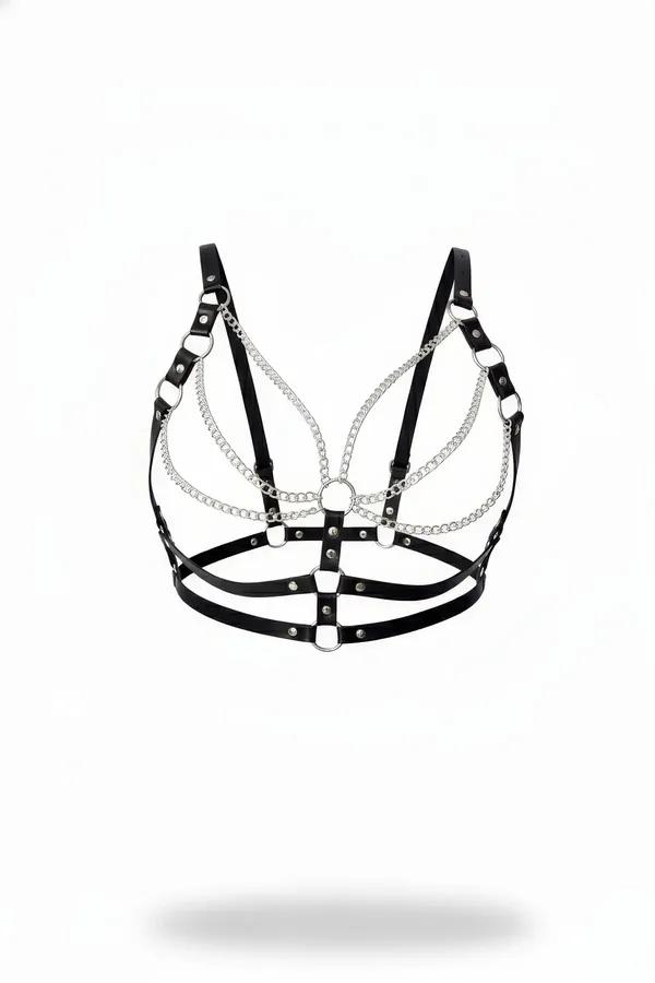 Black faux leather harness bra with three rows of silver draped chains and O-ring rivet studs on white background