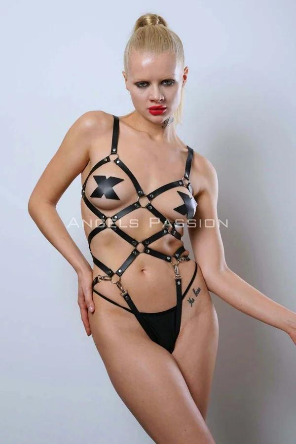 black faux leather strappy body harness with silver O-rings and stud rivets in geometric cage pattern