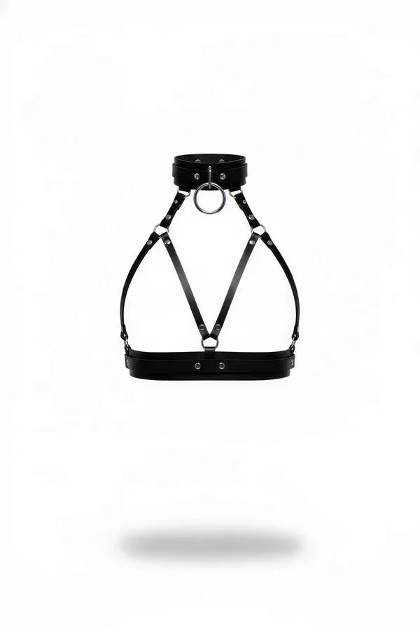 Black faux leather chest harness with integrated wide choker collar, diagonal cross-straps, silver O-ring pendant, and struct