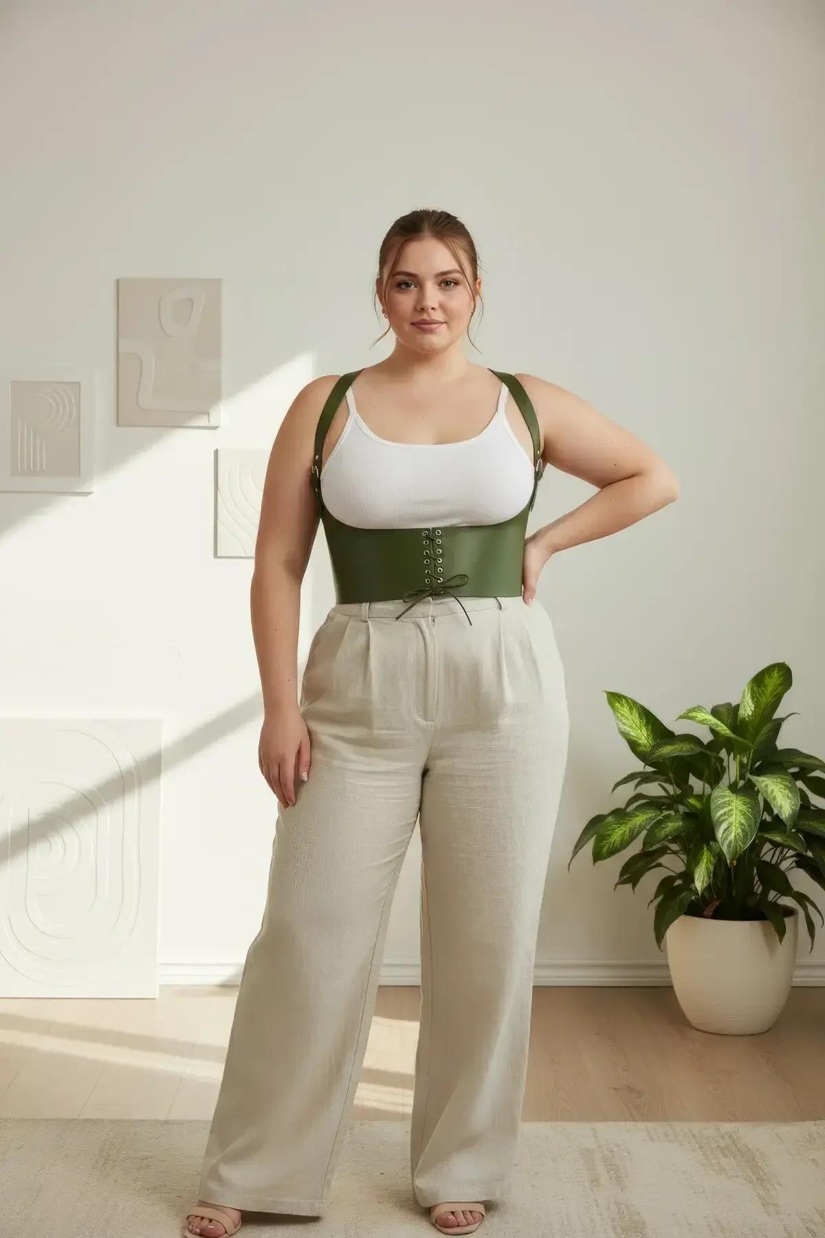 close-up of olive green faux leather corset front lace-up eyelets with gold-tone grommets and woven cord