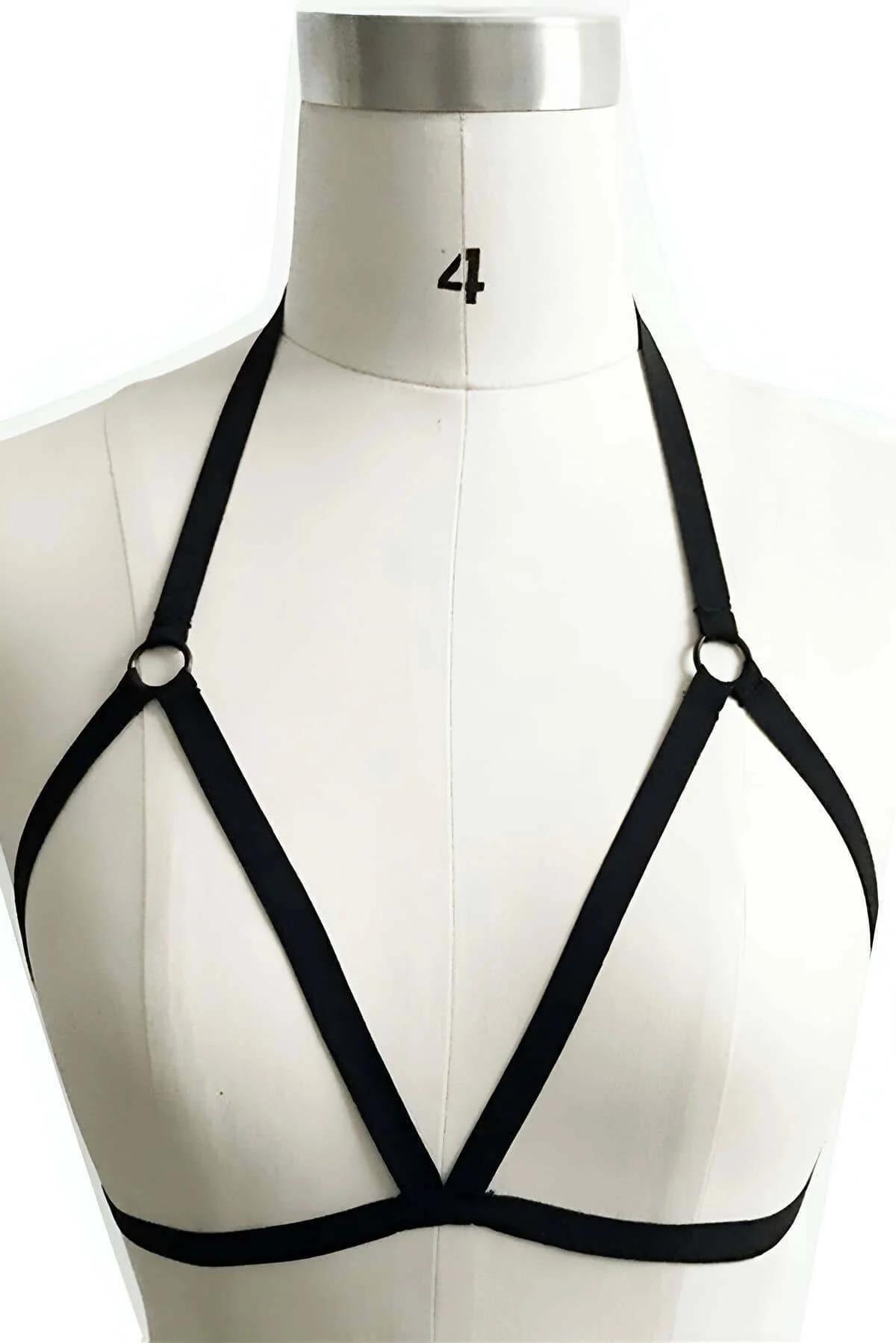 Black PU leather chest harness showing slim 1 cm adjustable straps and silver O-ring hardware at chest level