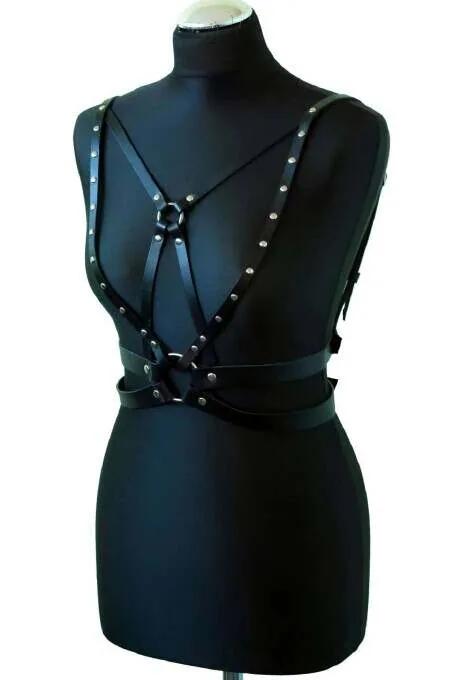 black faux leather chest harness with silver dome rivets and front O-ring on mannequin torso