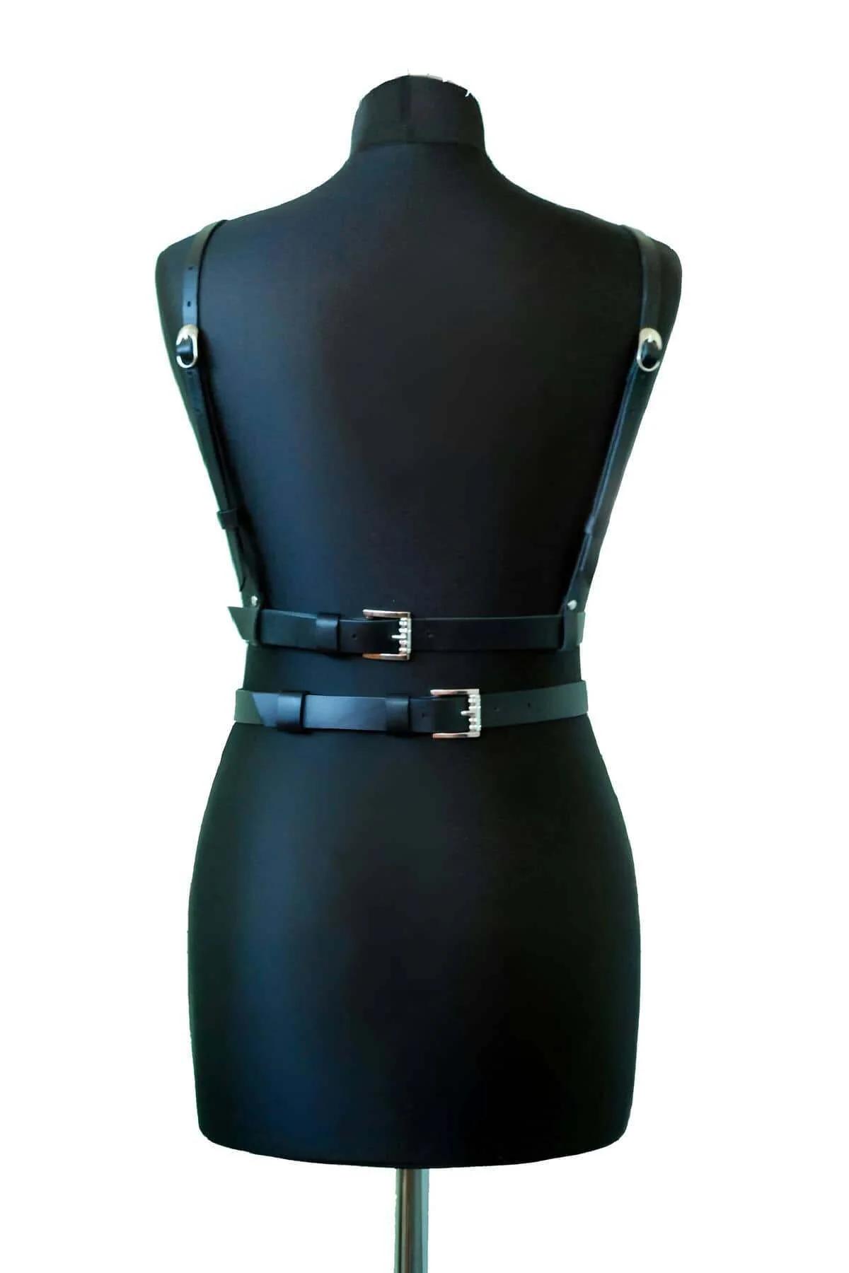 front O-ring detail on black faux leather chest harness center panel