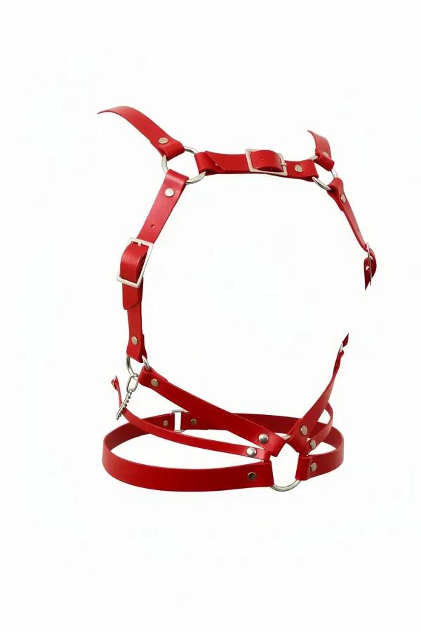 Red faux leather multi-strap body harness with silver O-rings, rectangular buckles, rivet studs, and front chain accent on wh