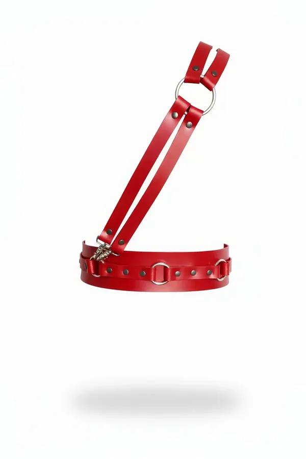 Red faux leather chest harness with silver O-ring accents and wide waist band, front view on white background