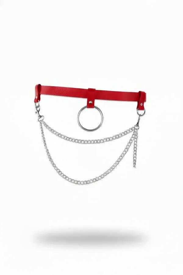 red faux leather O-ring waist belt with dual draped silver curb chains on white background