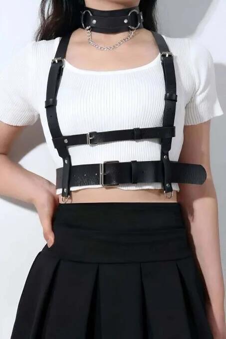 Black faux leather underbust harness with wide waist band, silver pin-buckle shoulder straps, and detachable O-ring chain wor