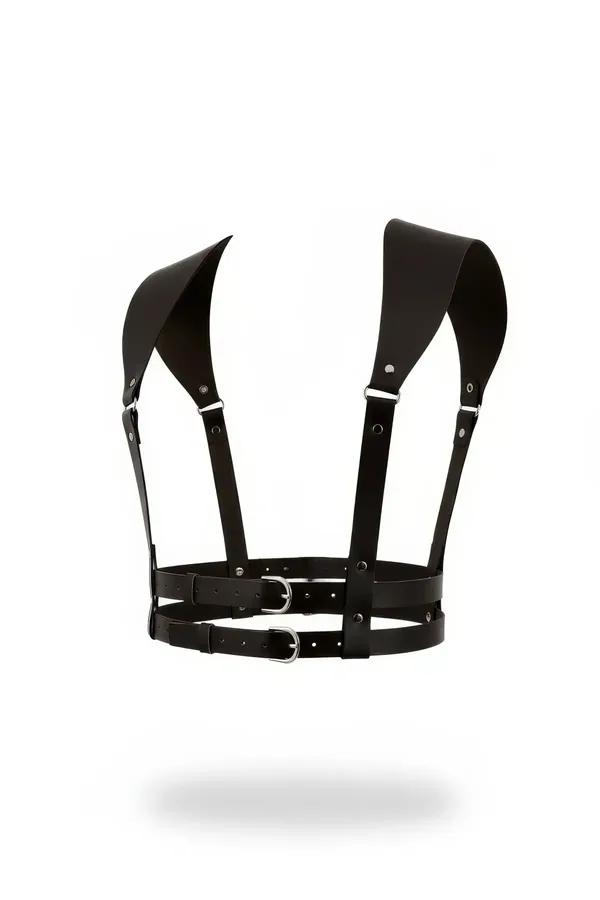 Black faux leather chest harness with wide sculptural shoulder panels and dual silver buckle waist straps