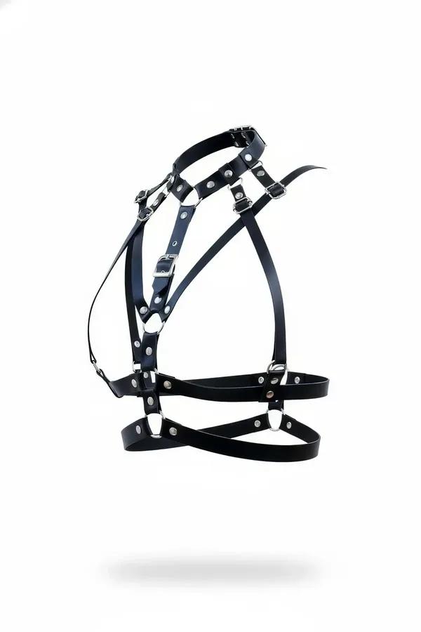 Black faux leather multi-strap body harness with silver round studs, D-rings, and rectangular buckles on white background