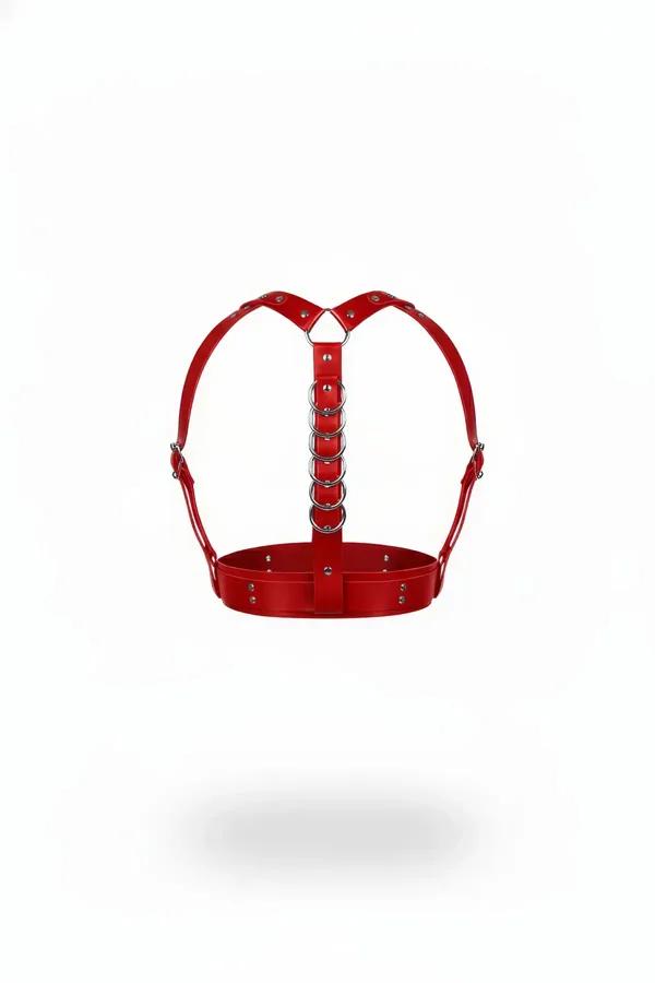 Red faux leather underbust harness with five stacked silver O-rings at center front and adjustable shoulder straps