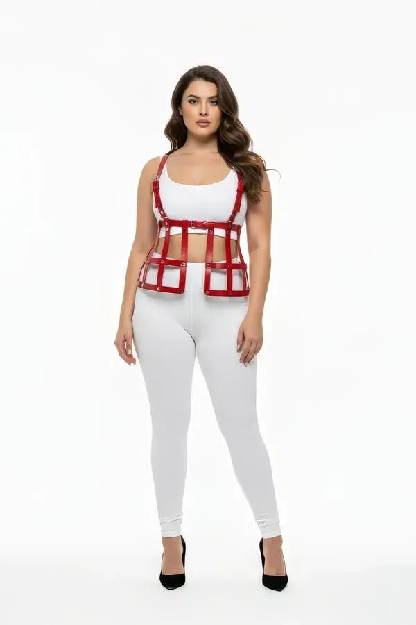Red vegan leather caged underbust harness vest top with gold-tone rivets and adjustable shoulder straps, worn over white crop
