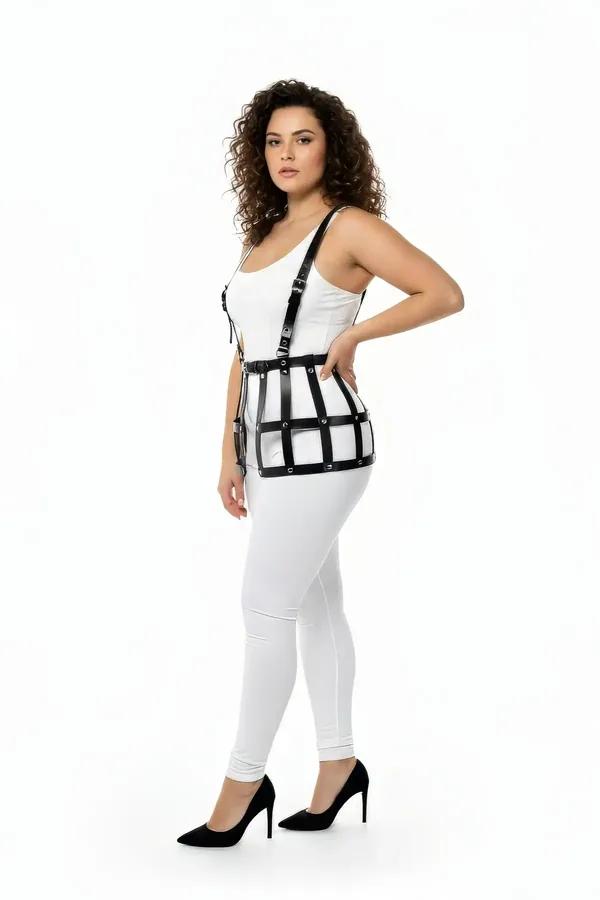 black matte faux leather caged waist harness with suspender straps and grid frame worn over white tank top