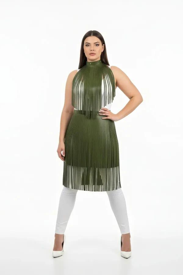 Olive green vegan leather halterneck top with dense vertical fringe strips reaching knee length, worn over white leggings