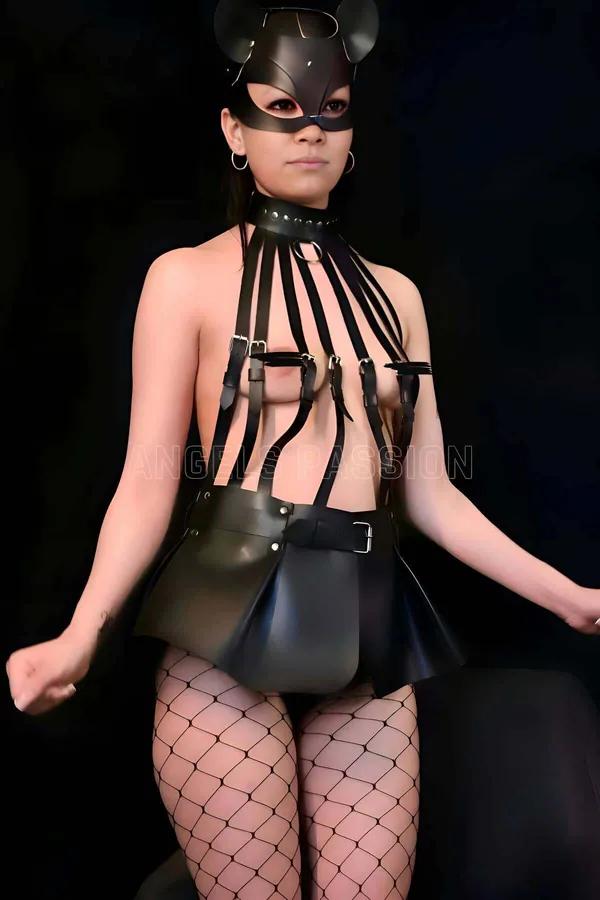 Black faux leather multi-strap bustier harness with flared mini skirt and silver buckle details, front view
