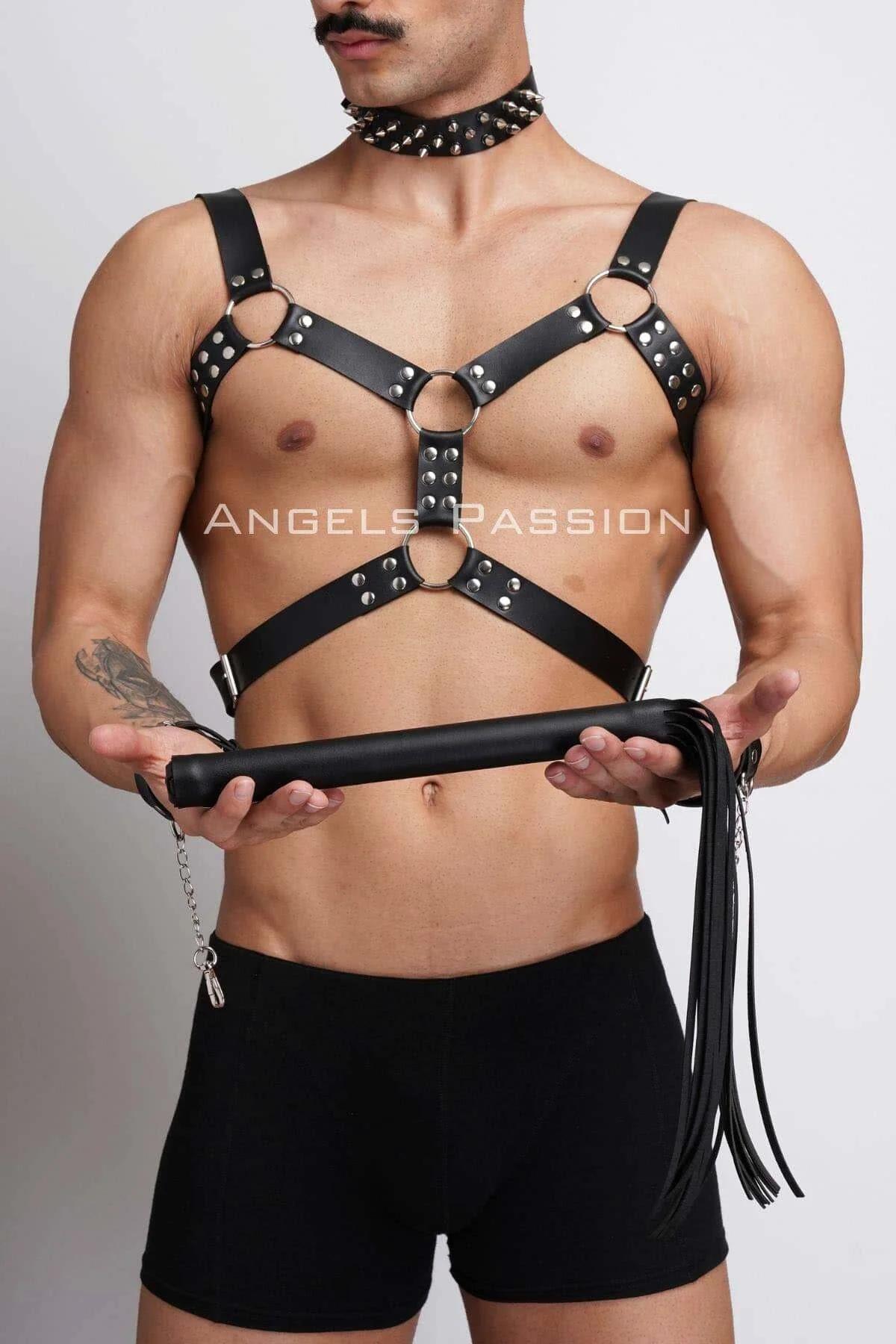 Flat lay of complete three-piece set: black harness, spiked choker, and matching cuffs with chain