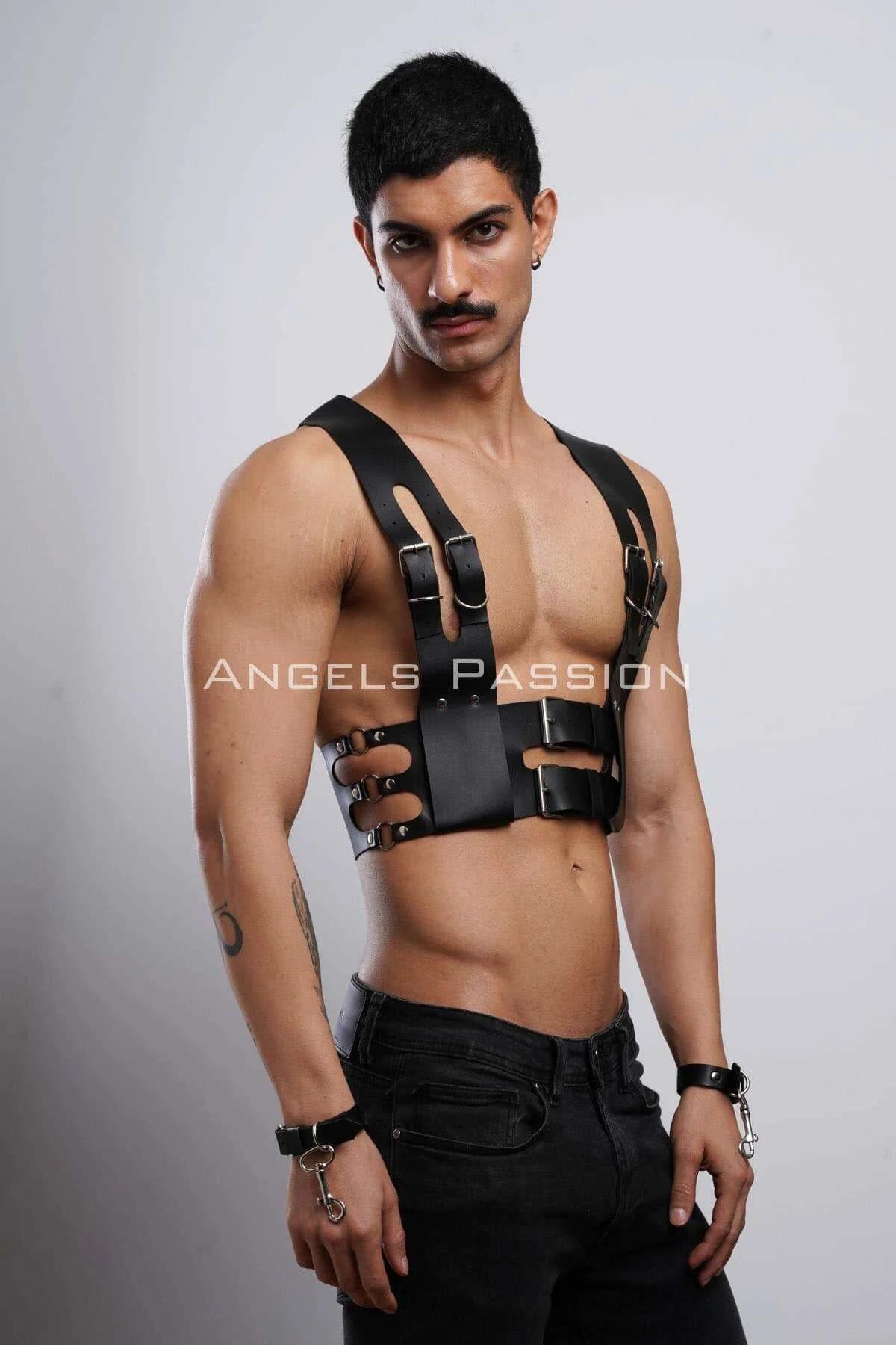 Close-up of double silver prong buckles on black faux leather waist band of mens chest harness