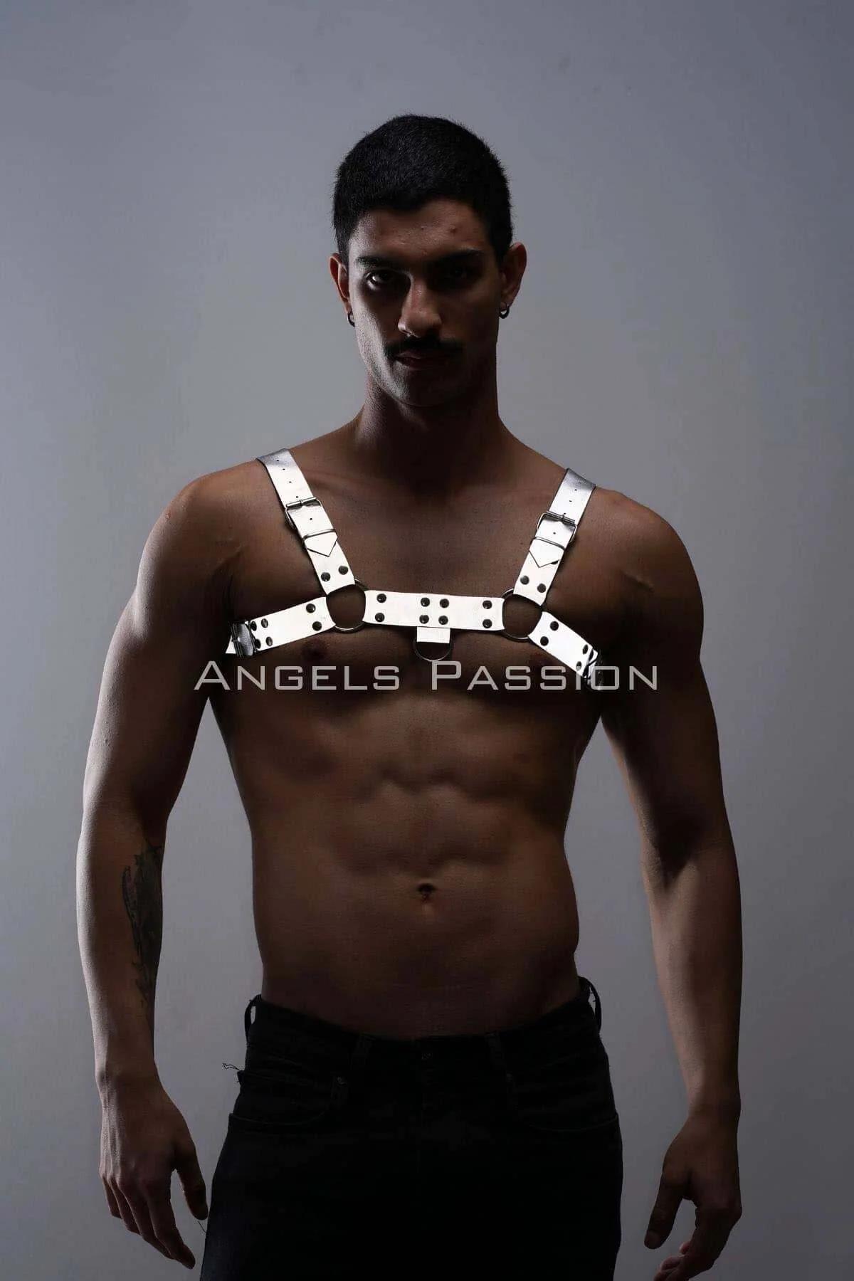 Close-up of white reflective faux leather harness straps with black stud rivets and O-ring connector