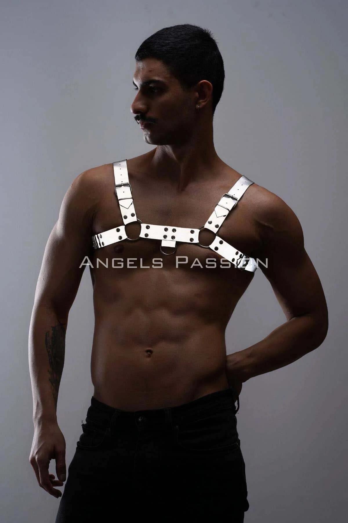 Side angle of wide-strap white harness with adjustable shoulder buckles and black metal hardware