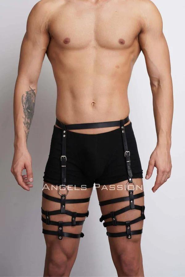 black faux leather leg harness with four horizontal thigh bands silver O-ring and adjustable buckles worn over black shorts