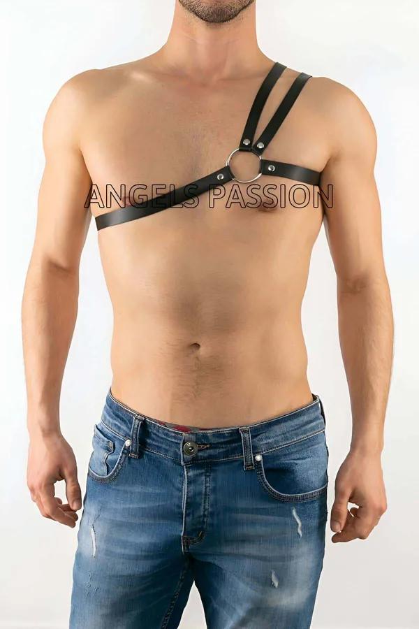 black vegan leather asymmetric single-shoulder chest harness with silver O-ring hardware worn over bare chest