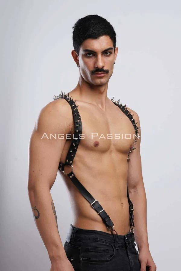 Black faux leather body harness with silver spike shoulder strap and O-ring chest detail on male model