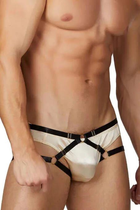 cream satin mens harness brief with black faux leather cross straps and gold O-ring accents front view