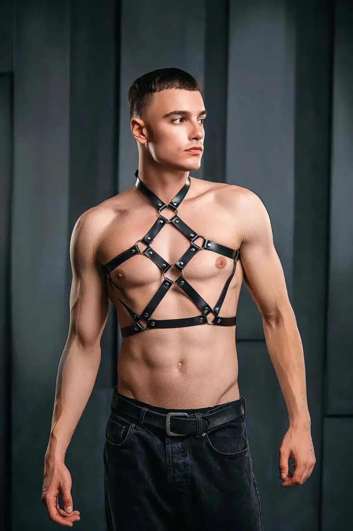 Front view of black PU leather cage chest harness showing four riveted O-ring junctions across chest panel