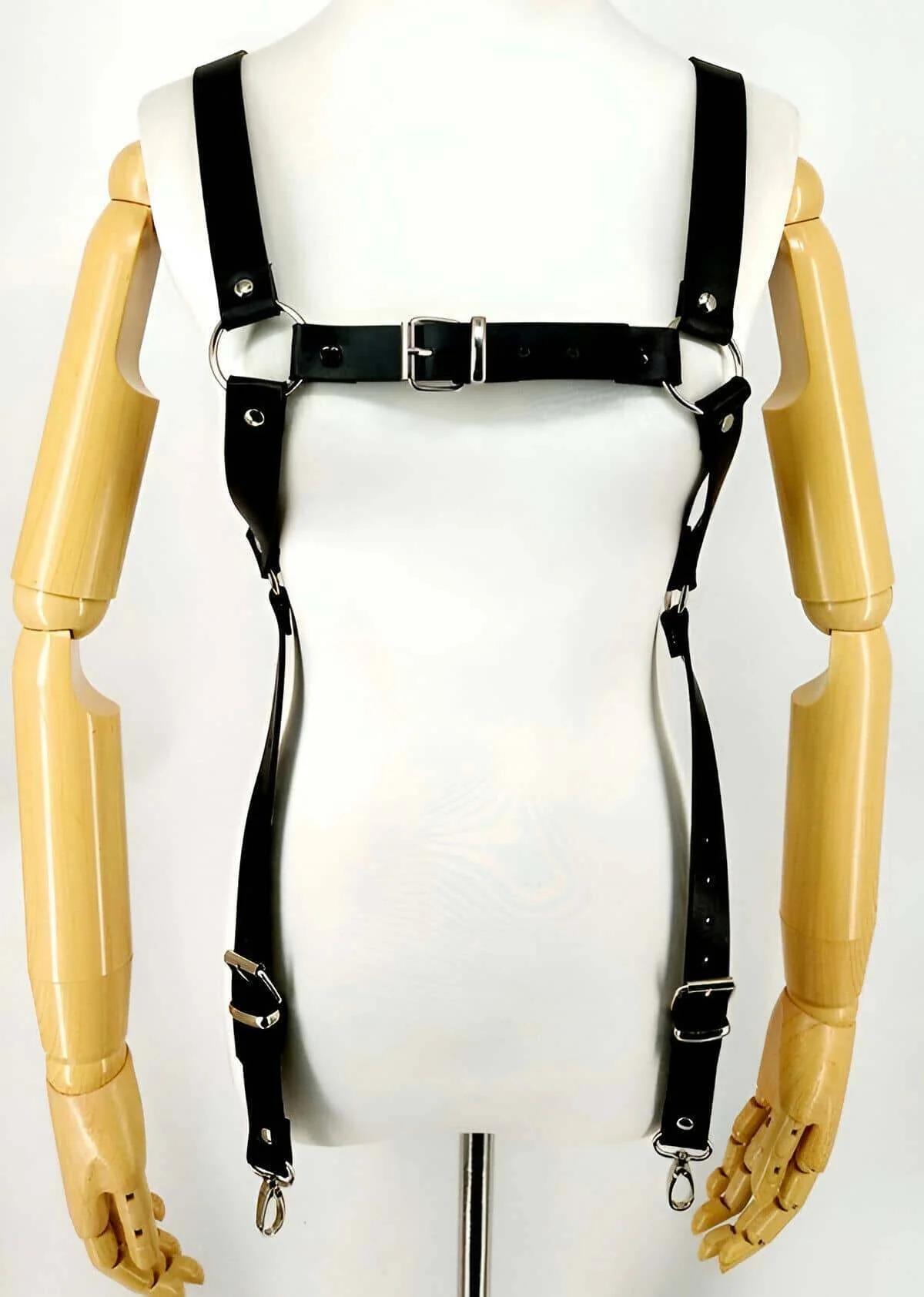 diagonal body strap and waist buckle detail on black vegan leather men's harness