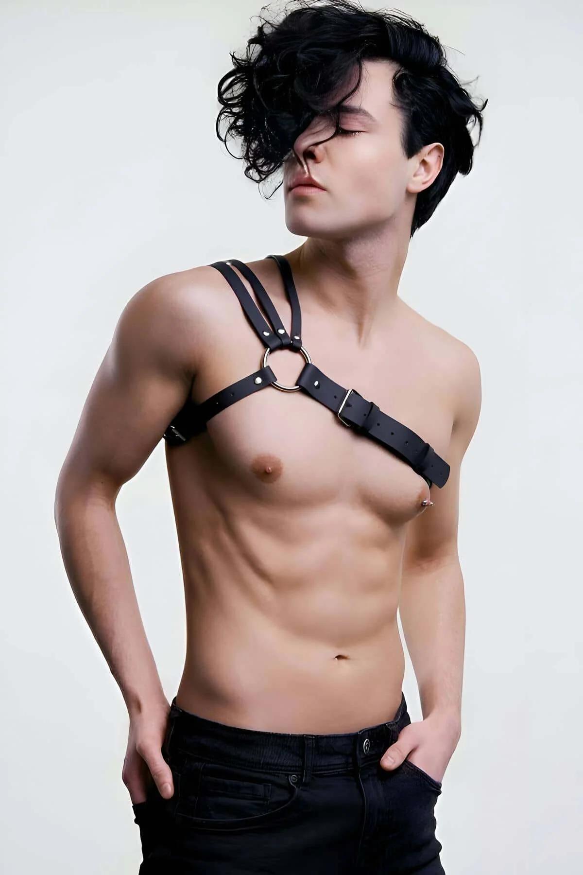 Side view black vegan leather asymmetric chest harness with pin buckle detail