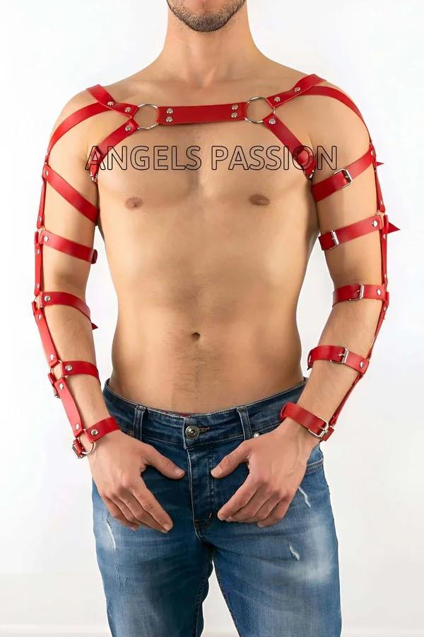 Red faux leather arm and chest harness set with chrome O-rings and multi-strap arm sleeves on male model