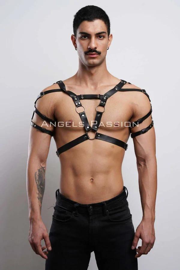 Black faux leather men's V-strap chest harness with dual silver O-rings and rivet detailing, adjustable shoulder buckles
