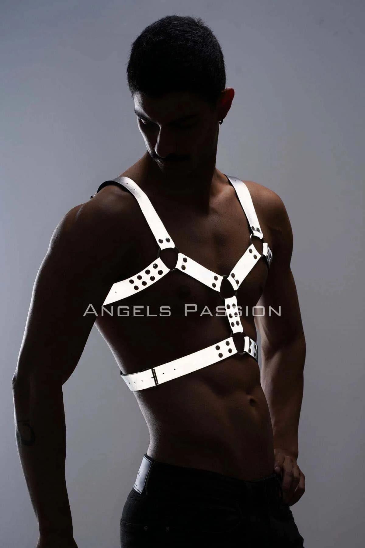 White and black reflective chest harness worn over bare torso showing lower waist band and sternum ring