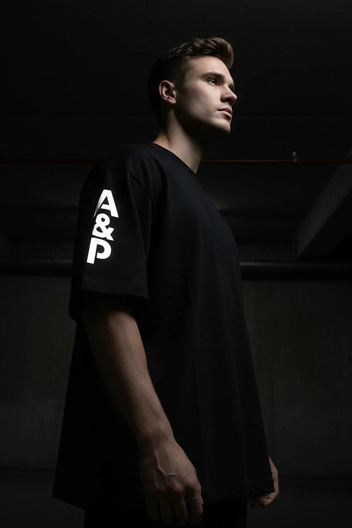 custom printed black oversize cotton tee with large reflective A&P back logo drop-shoulder streetwear silhouette