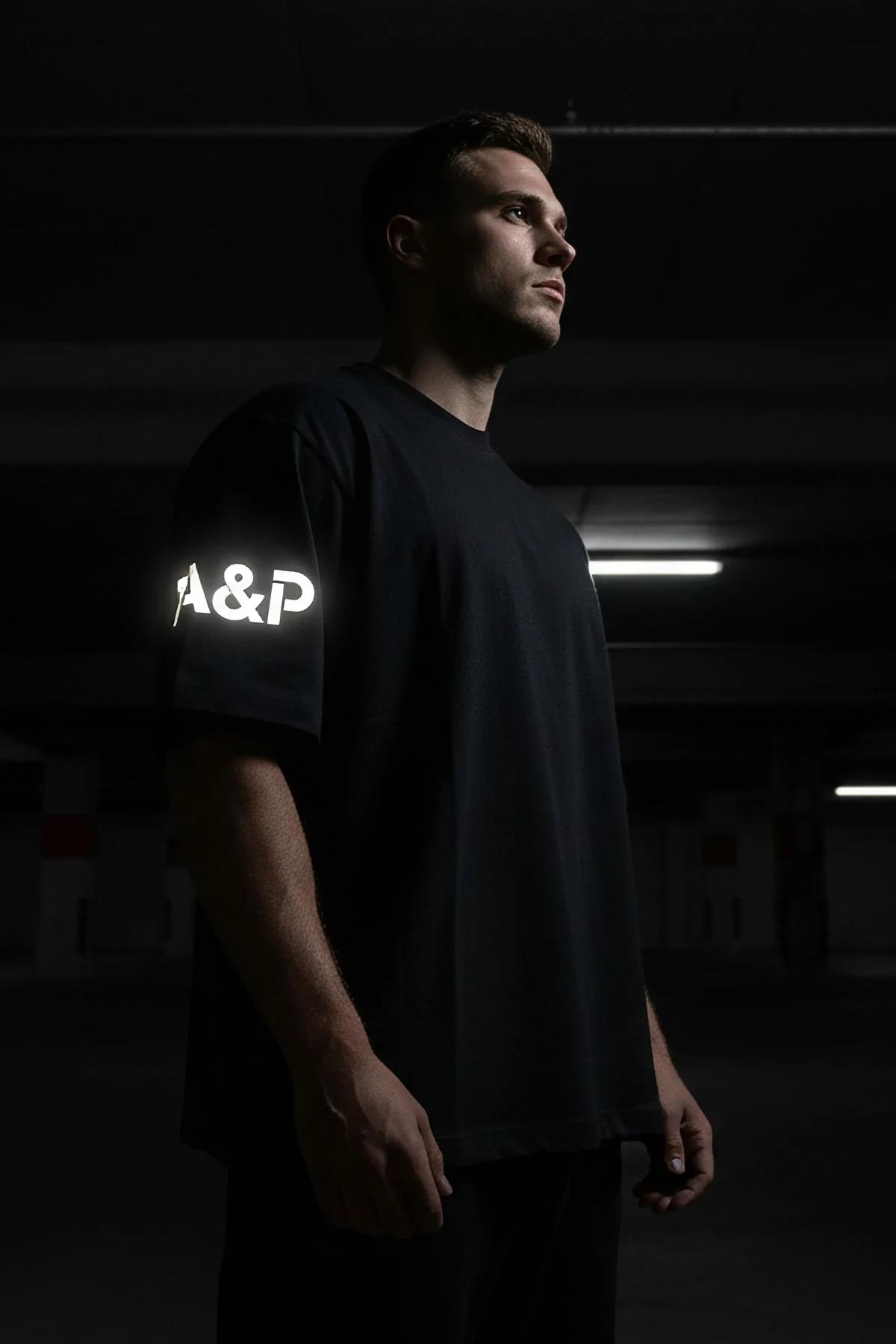 custom printed black oversize cotton tee with large reflective A&P back logo drop-shoulder streetwear silhouette