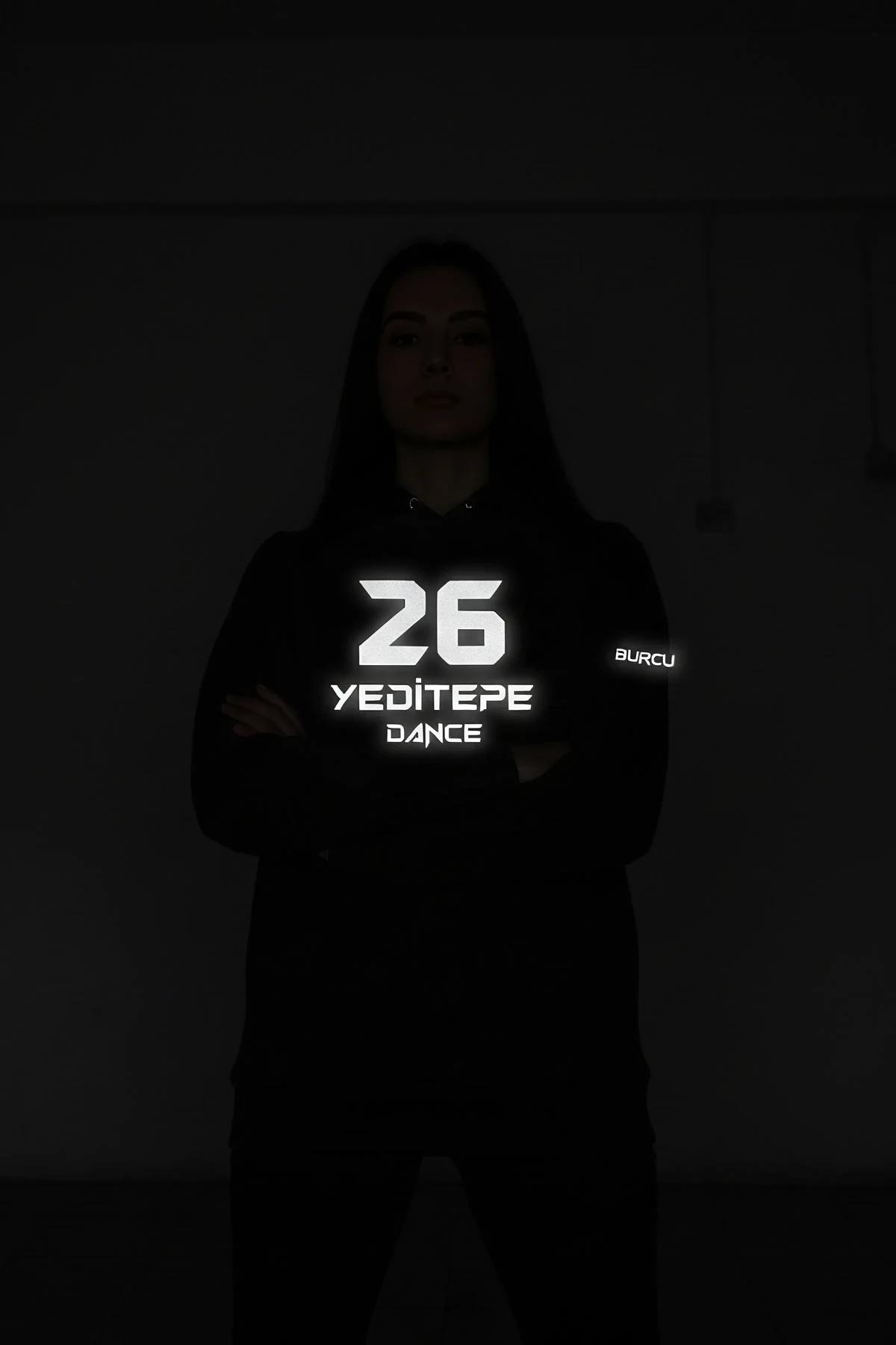 black custom reflective long sleeve top back view with white retroreflective team name number and sleeve name print glowing i