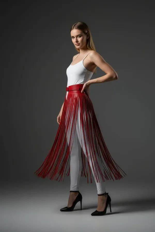 Red faux leather fringe skirt overlay belt with 90 cm strands worn over white skinny jeans
