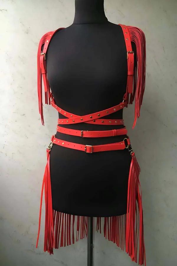 Red faux leather fringe harness set with gold studs — shoulder epaulettes and waist skirt belt on mannequin