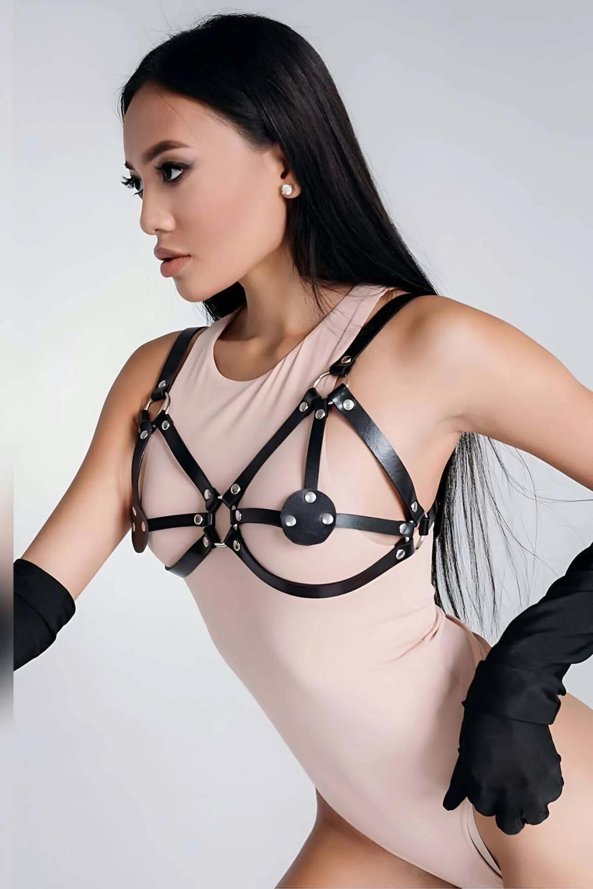 black faux leather harness bra with silver rivet stud medallion and adjustable multi-strap cage design