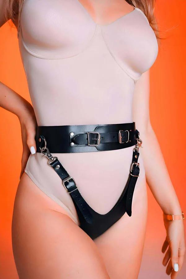 black faux leather wide waist belt harness with adjustable thong straps and silver buckles on mannequin