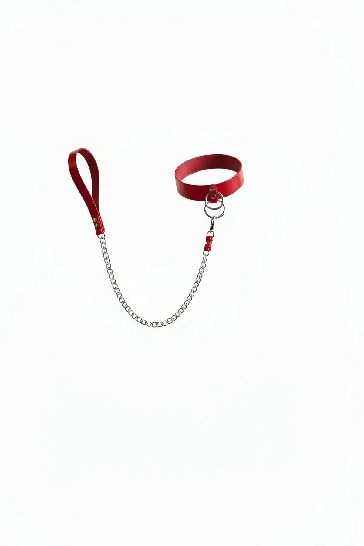 red faux leather choker with silver O-ring and detachable silver link chain leash and loop handle on white background