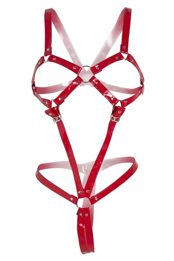 glossy red patent faux leather full body harness with central silver O-ring and adjustable buckles on white background