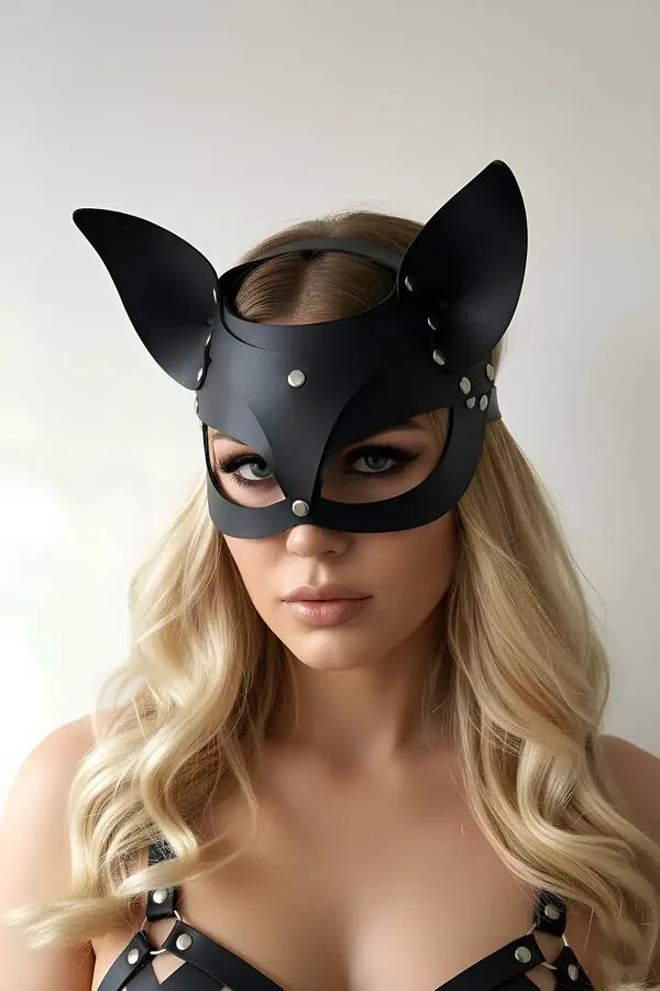 Black faux leather cat mask with pointed ears and silver dome studs worn on face, matte finish, front view
