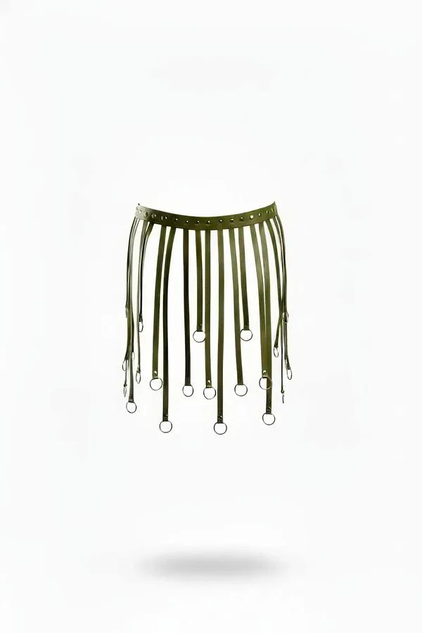 Olive green faux leather harness skirt overlay with staggered vertical straps and silver O-rings on white background