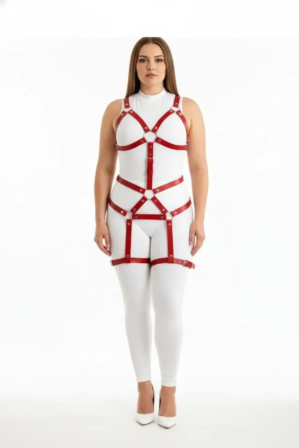 red faux leather full body harness with silver O-rings chest cage waist panel and thigh bands worn over white bodysuit