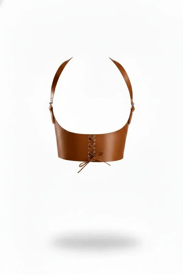 tan vegan leather underbust corset harness with front lace-up eyelets and silver buckle shoulder straps